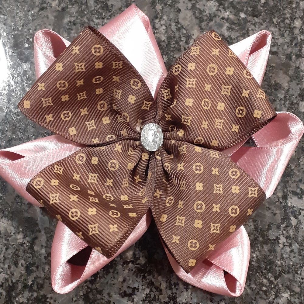 Boutique bow. Pink pale with brown stylish ribbon